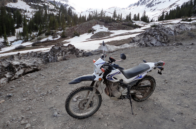 My Yamaha XT-250 in the parking area, with Twin Falls in the background.