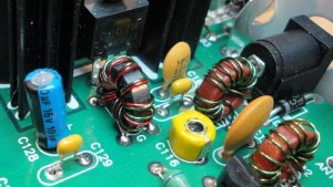 The circuit board of the OHR 100A, showing two of the transmitter toroids, one of which is bifilar (two turns on the same core).  C116 (yellow) is one of the trimmer capacitors that must be adjusted.