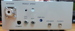 Rear panel of the Oak Hills Research 100A. The keyer option hasn't been installed yet, so those holes are vacant. Note the unusual key connector: an RCA jack! The radio has separate connections for headphones and a speaker; attaching headphones will mute the speaker.
